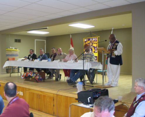 People seated at a Lions Club meeting.