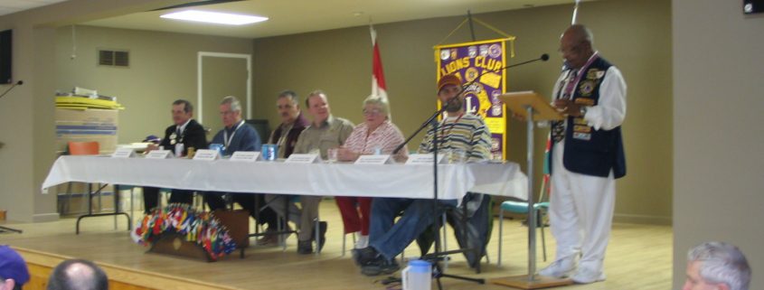 People seated at a Lions Club meeting.