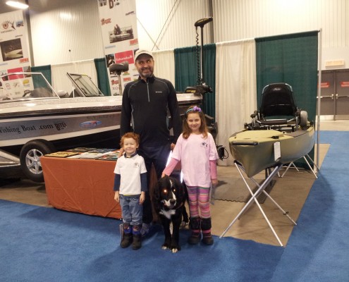 A group of children and a woman in a gym setting.