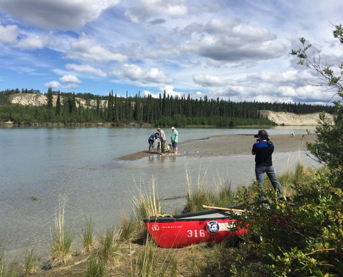 Lawrence and Dave Brown in Takhini River with huskies