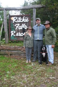 Lawrence, Kyla and Matthew, standing in front of the Ritchie Falls Resort sign