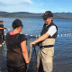 Greg Taylor with Watershed Watch's Salmon Society on the Pacific Coast cast nets to investigate why the slamon are slow to return