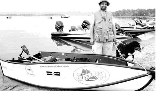 Man with boat and dog on shore.